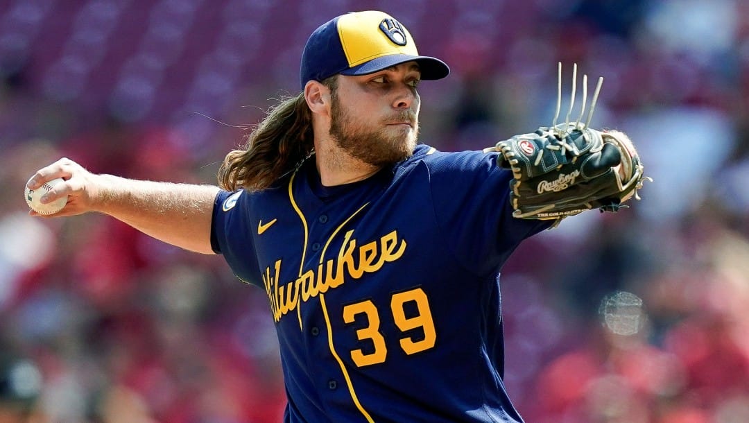 Milwaukee Brewers starting pitcher Corbin Burnes throws during the ninth inning of the team's baseball game against the Cincinnati Reds in Cincinnati, on July 18, 2021. Burnes faces a major challenge trying to improve upon a spectacular 2021 season that earned him the NL Cy Young Award
