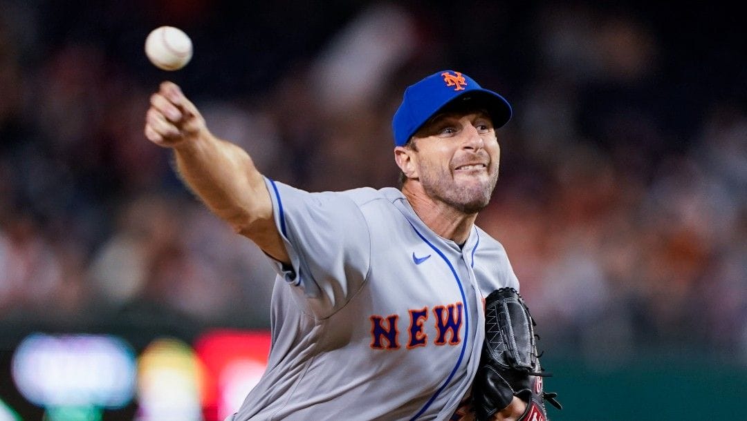 New York Mets starting pitcher Max Scherzer throws during the fourth inning of a baseball game against the Washington Nationals at Nationals Park, Friday, April 8, 2022, in Washington.