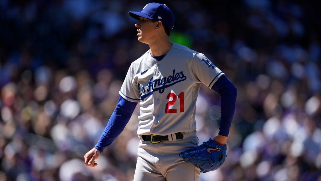 Los Angeles Dodgers starting pitcher Walker Buehler (21) in the first inning of a baseball game Friday, April 8, 2022, in Denver.