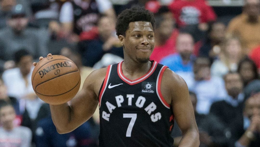 Kyle Lowry dribbles up court in a game with the Raptors.