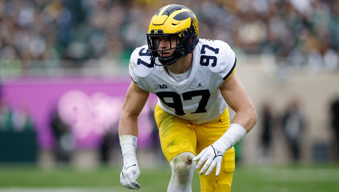 Michigan's Aidan Hutchinson plays during an NCAA college football game against Michigan State on Saturday, Oct. 30, 2021, in East Lansing, Mich.