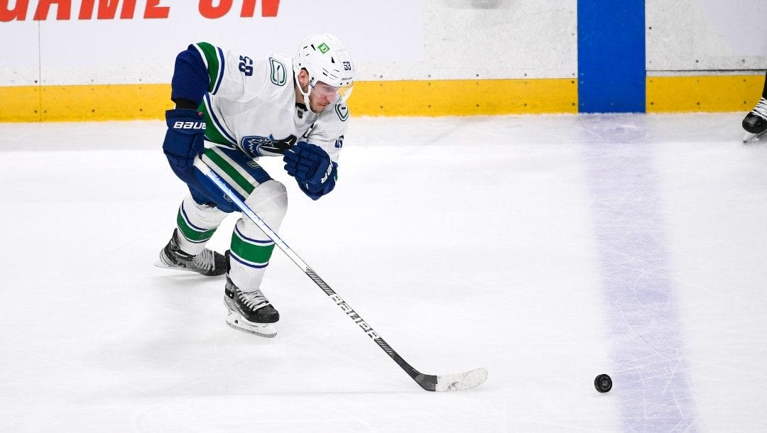 Vancouver Canucks center Bo Horvat in action against the Minnesota Wild during the third period of an NHL hockey game Thursday, March 24, 2022, in St. Paul, Minn. The Wild won 3-2 in overtime.