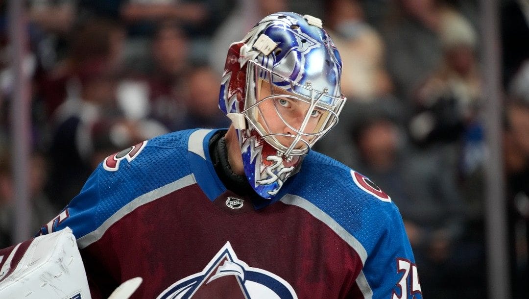 Colorado Avalanche goaltender Darcy Kuemper pauses on the ice during a timeout in the the second period of the team's NHL hockey game against the Los Angeles Kings on Wednesday, April 13, 2022, in Denver.