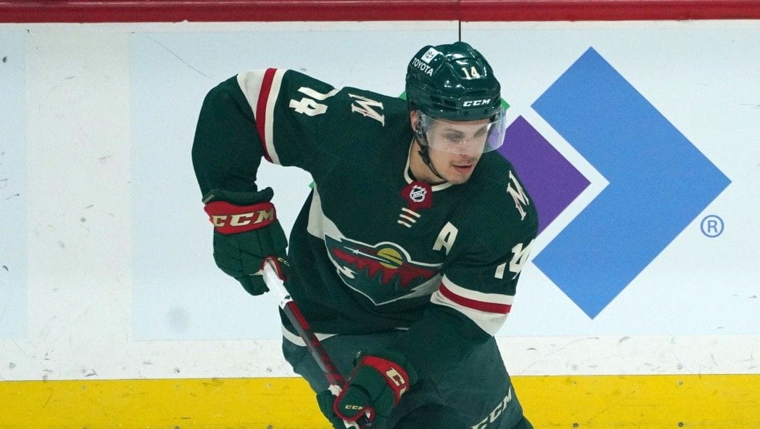 Minnesota Wild's Joel Eriksson Ek (14) plays in an NHL hockey game against the Arizona Coyotes, Tuesday, April 26, 2022, in St. Paul, Minn.