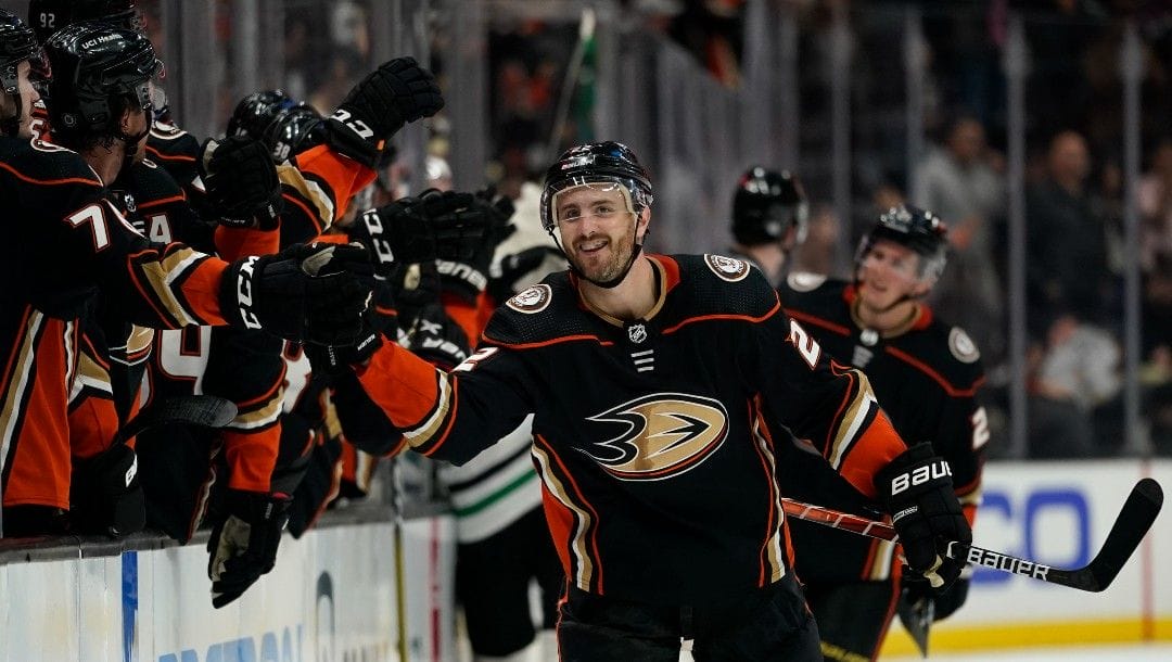 Anaheim Ducks defenseman Kevin Shattenkirk (22) celebrates with teammates after scoring during the third period of an NHL hockey game against the Dallas Stars in Anaheim, Calif., Thursday, March 31, 2022.