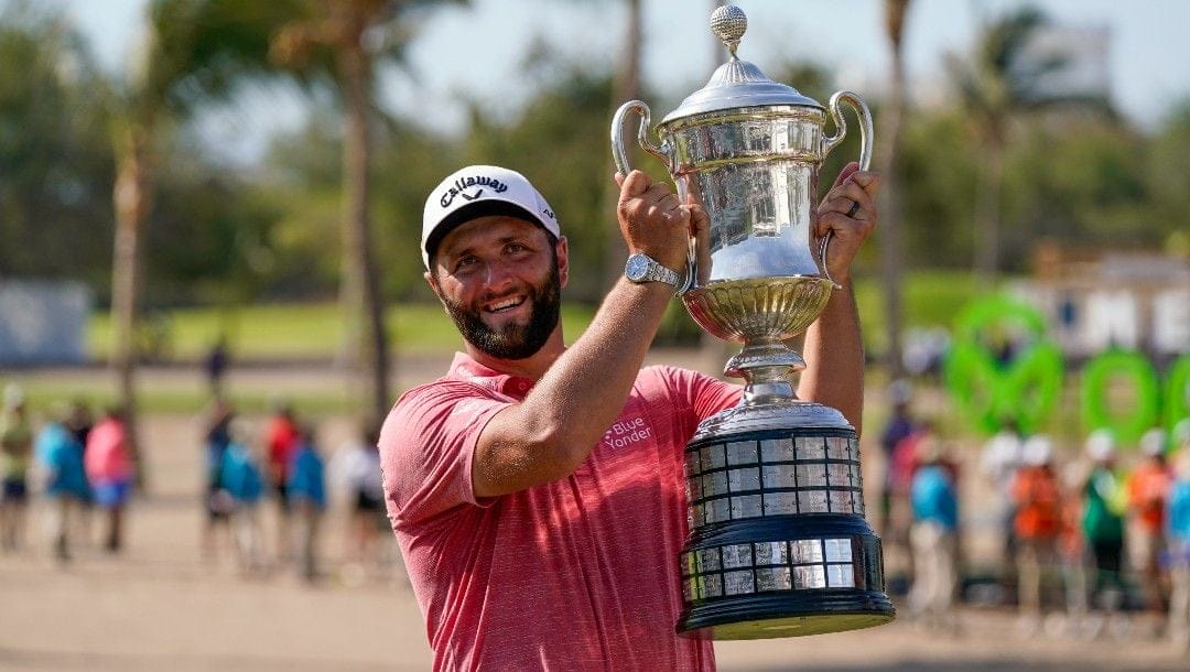 Jon Rahm, of Spain, holds the championship trophy after winning the Mexico Open at Vidanta, in Puerto Vallarta, Mexico, Sunday, May 1, 2022.