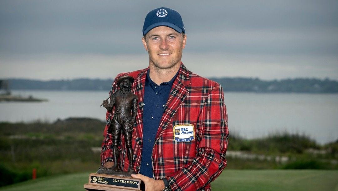Jordan Spieth holds the championship trophy after winning the RBC Heritage golf tournament, Sunday, April 17, 2022, in Hilton Head Island, S.C.
