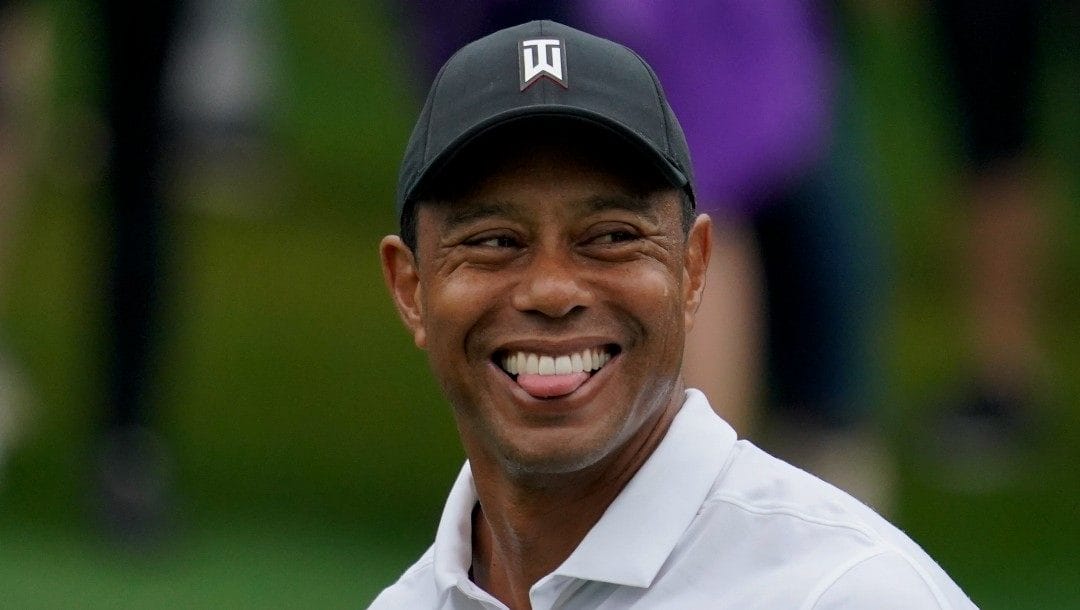 Tiger Woods walks on the 15th fairway during a practice round for the Masters golf tournament on Wednesday, April 6, 2022, in Augusta, Ga.