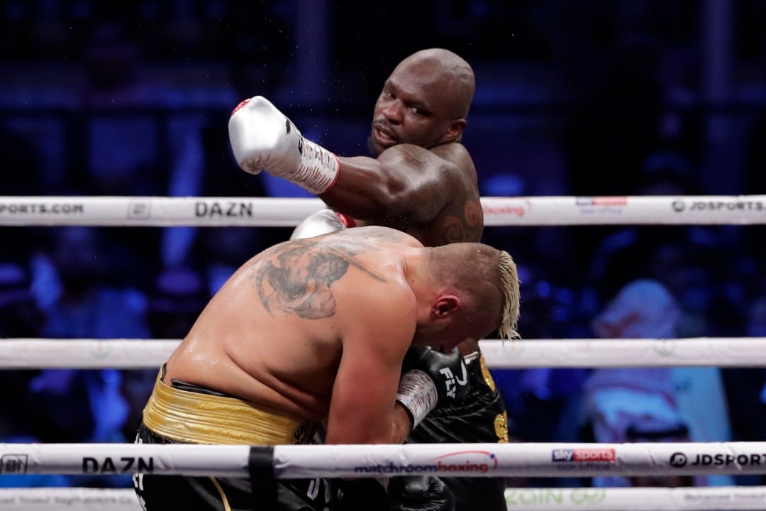 Dillian Whyte of Britain, right, and Mariusz Wach of Poland fight during a heavyweight undercard boxing match at the Diriyah Arena, in Riyadh, Saudi Arabia, Saturday, Dec. 7, 2019.
