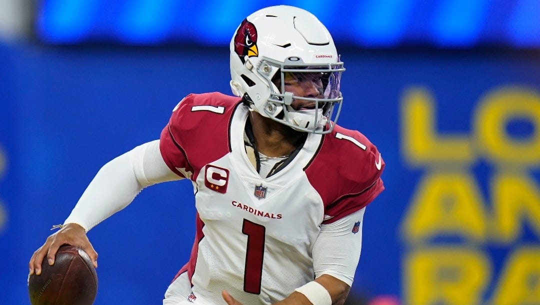 Arizona Cardinals quarterback Kyler Murray (1) rolls out against the Los Angeles Rams during the first half of an NFL wild-card playoff football game in Inglewood, Calif., Monday, Jan. 17, 2022. (AP Photo/Jae C. Hong)