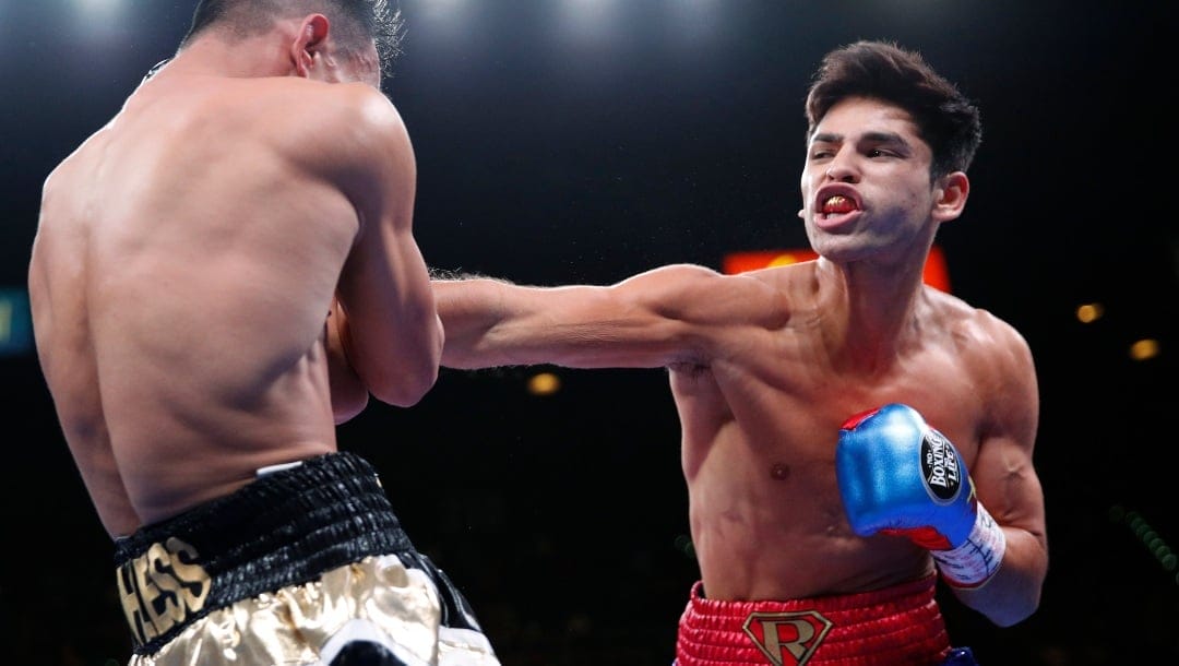 Ryan Garcia hits Romero Duno during a lightweight boxing bout Saturday, Nov. 2, 2019, in Las Vegas.