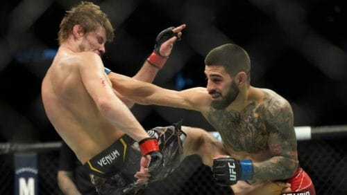 Ilia Topuria, right, hits Bryce Mitchell during a UFC 282 mixed martial arts featherweight bout Saturday, Dec. 10, 2022.