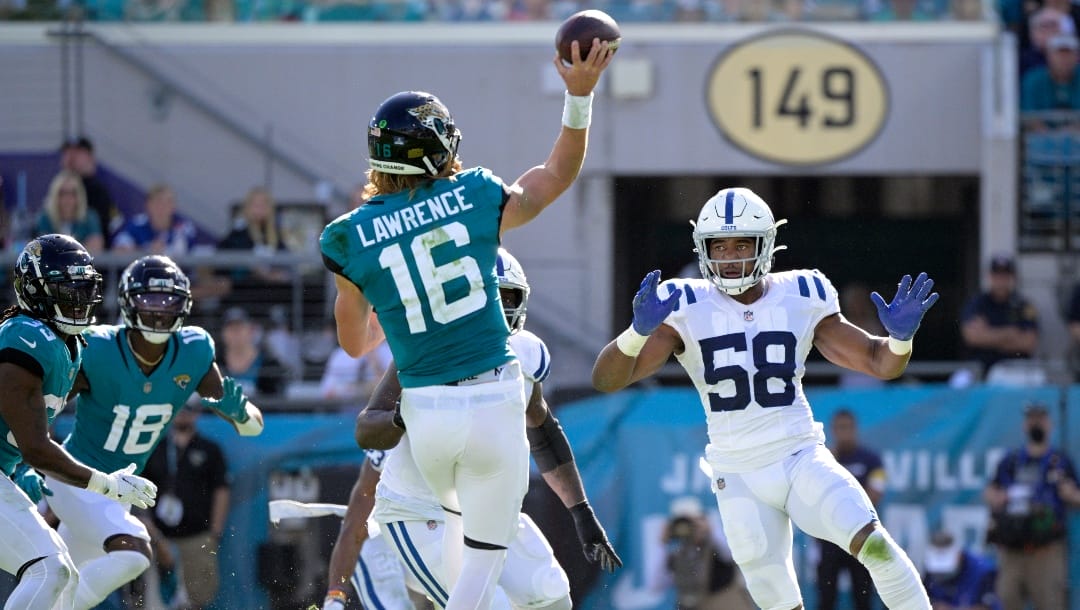 Indianapolis Colts middle linebacker Bobby Okereke (58) pressures Jacksonville Jaguars quarterback Trevor Lawrence (16) on a pass play during the first half of an NFL football game, Sunday, Jan. 9, 2022, in Jacksonville, Fla. (AP Photo/Phelan M. Ebenhack)