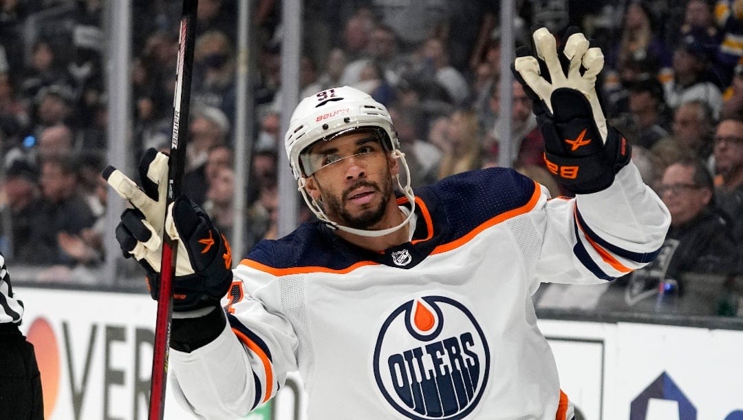 Edmonton Oilers left wing Evander Kane gestures after scoring an empty net goal during the third period in Game 6 of an NHL hockey Stanley Cup first-round playoff series against the Los Angeles Kings Thursday, May 12, 2022, in Los Angeles. (AP Photo/Mark J. Terrill)
