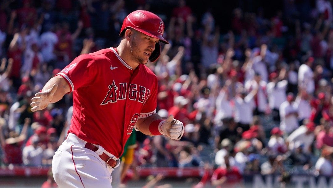 Los Angeles Angels' Mike Trout rounds first after hitting a solo home run during the seventh inning of a baseball game against the Oakland Athletics Sunday, May 22, 2022, in Anaheim, Calif.
