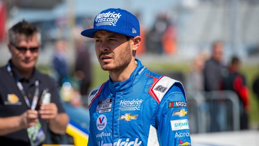 Kyle Larson (5) walks to his car for NASCAR Cup Series practice at Dover Motor Speedway, Saturday, April 30, 2022, in Dover, Del.