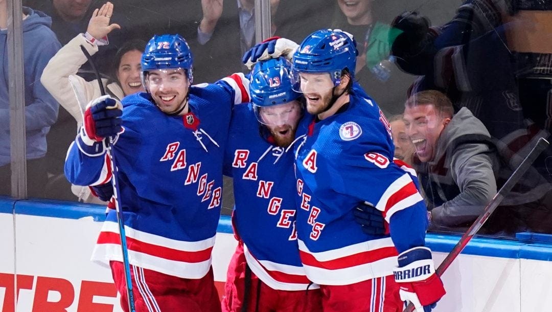 New York Rangers' Alexis Lafrenière (13) celebrates after scoring a goal during the second period of Game 5 of an NHL hockey Stanley Cup first-round playoff series against the Pittsburgh Penguins Wednesday, May 11, 2022, in New York.