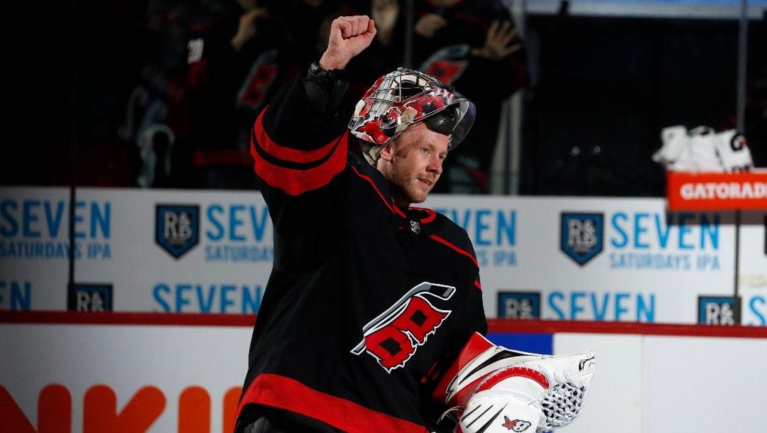 Carolina Hurricanes goaltender Antti Raanta (32) salutes the crowd following the Hurricanes win over the Boston Bruins in Game 1 of an NHL hockey Stanley Cup first-round playoff series in Raleigh, N.C., Monday, May 2, 2022.