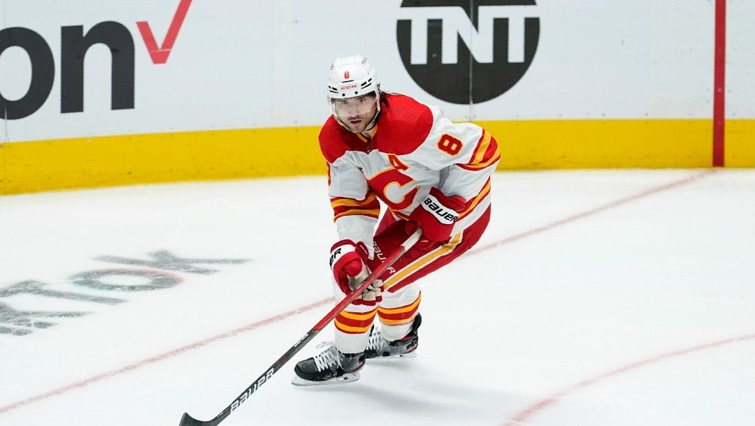 Calgary Flames defenseman Christopher Tanev controls the puck during Game 3 of an NHL hockey Stanley Cup first-round playoff series against the Dallas Stars, Sunday, May 8, 2022, in Dallas.