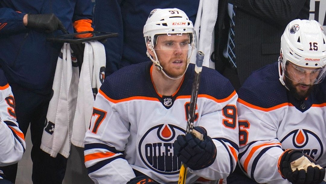 Edmonton Oilers' Connor McDavid sits on the bench during an NHL hockey game against the Pittsburgh Penguins in Pittsburgh, Tuesday, April 26, 2022.