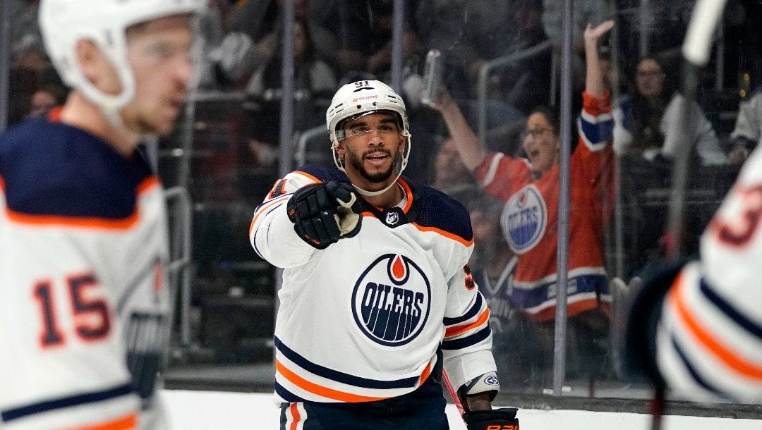 Edmonton Oilers left wing Evander Kane, center, celebrates his goal during the third period in Game 3 of an NHL hockey Stanley Cup first-round playoff series against the Los Angeles Kings Friday, May 6, 2022, in Los Angeles. It was his third goal of the game.