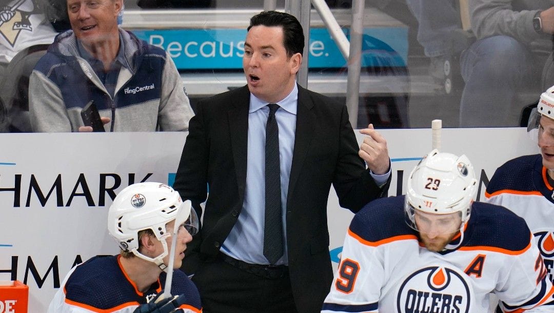 Edmonton Oilers head coach Jay Woodcroft gives instructions during the first period of the team's NHL hockey game against the Pittsburgh Penguins in Pittsburgh, Tuesday, April 26, 2022. The Oilers won 5-1.