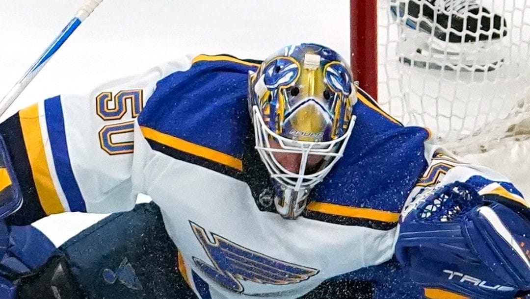 St. Louis Blues goaltender Jordan Binnington (50) makes a save against the Colorado Avalanche during the third period in Game 1 of an NHL hockey Stanley Cup second-round playoff series Tuesday, May 17, 2022, in Denver. Colorado beat St. Louis 3-2.