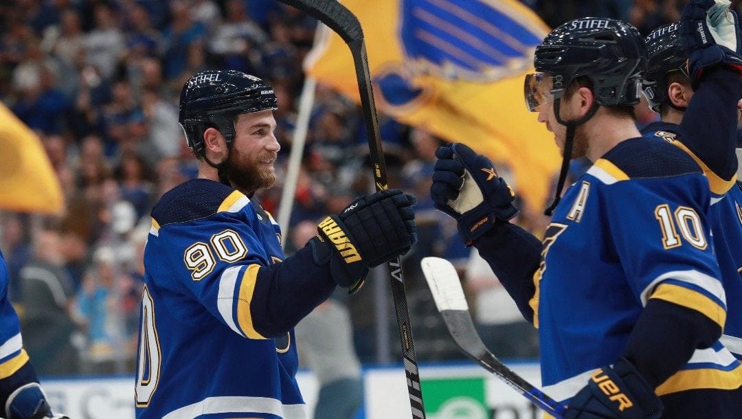 St. Louis Blues' Ryan O'Reilly (90) and Brayden Schenn (10) celebrate after the Blues defeated the Minnesota Wild in Game 6 of an NHL hockey Stanley Cup first-round playoff series Thursday, May 12, 2022, in St. Louis. The Blues advance to the second round.
