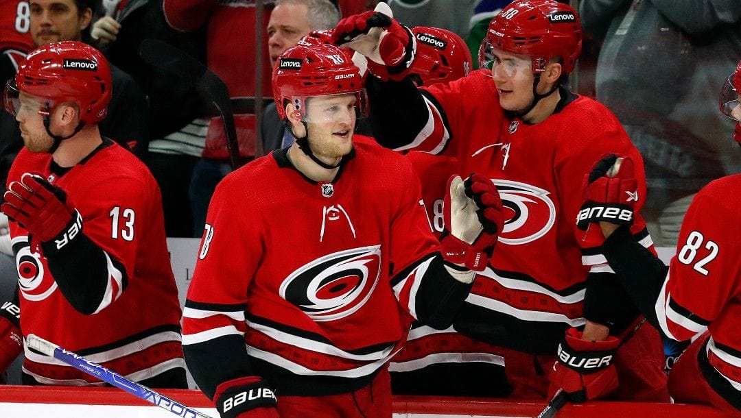 Carolina Hurricanes' Steven Lorentz (78) is congratulated on his goal by teammate Martin Necas (88) during the third period of an NHL hockey game against the New Jersey Devils in Raleigh, N.C., Thursday, April 28, 2022.