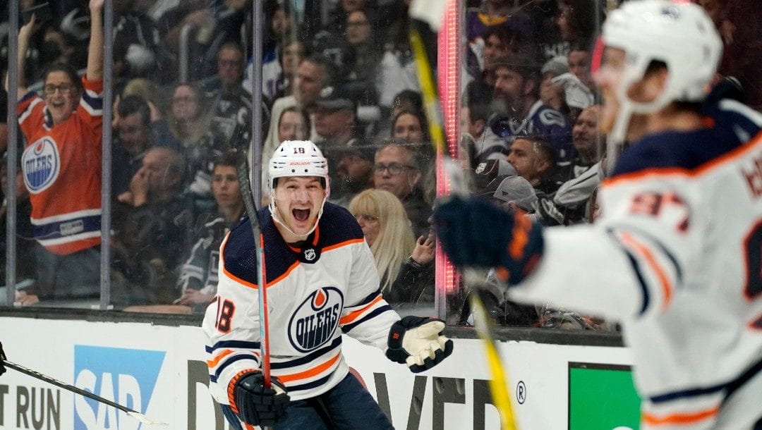 Edmonton Oilers left wing Zach Hyman, left, celebrates his power play goal with center Connor McDavid during the first period in Game 3 of an NHL hockey Stanley Cup first-round playoff series against the Los Angeles Kings Friday, May 6, 2022, in Los Angeles.