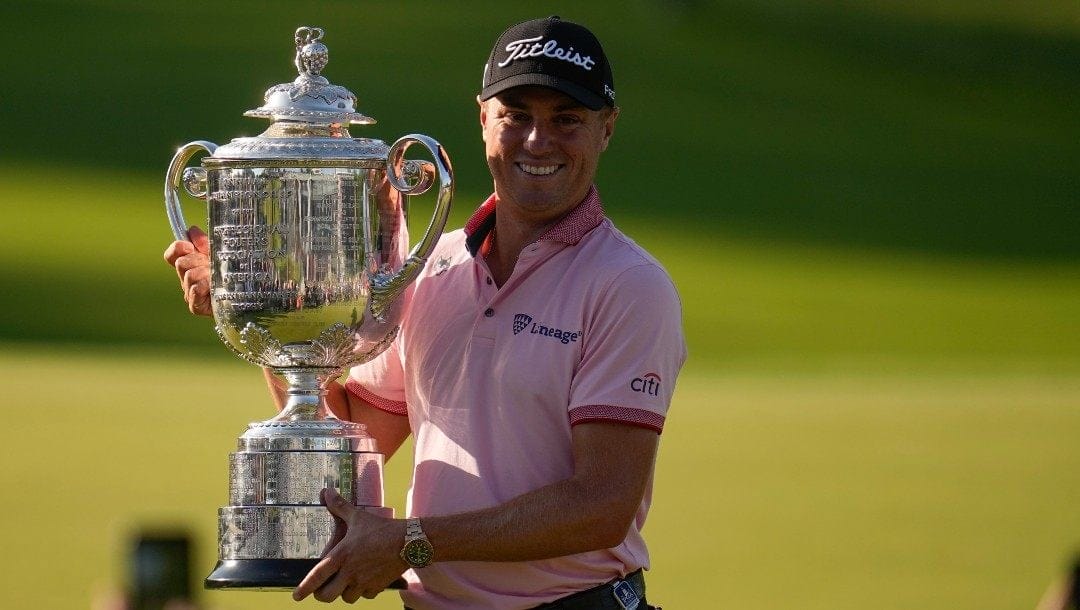 Justin Thomas holds the Wanamaker Trophy after winning the PGA Championship golf tournament in a playoff against Will Zalatoris at Southern Hills Country Club, Sunday, May 22, 2022, in Tulsa, Okla.
