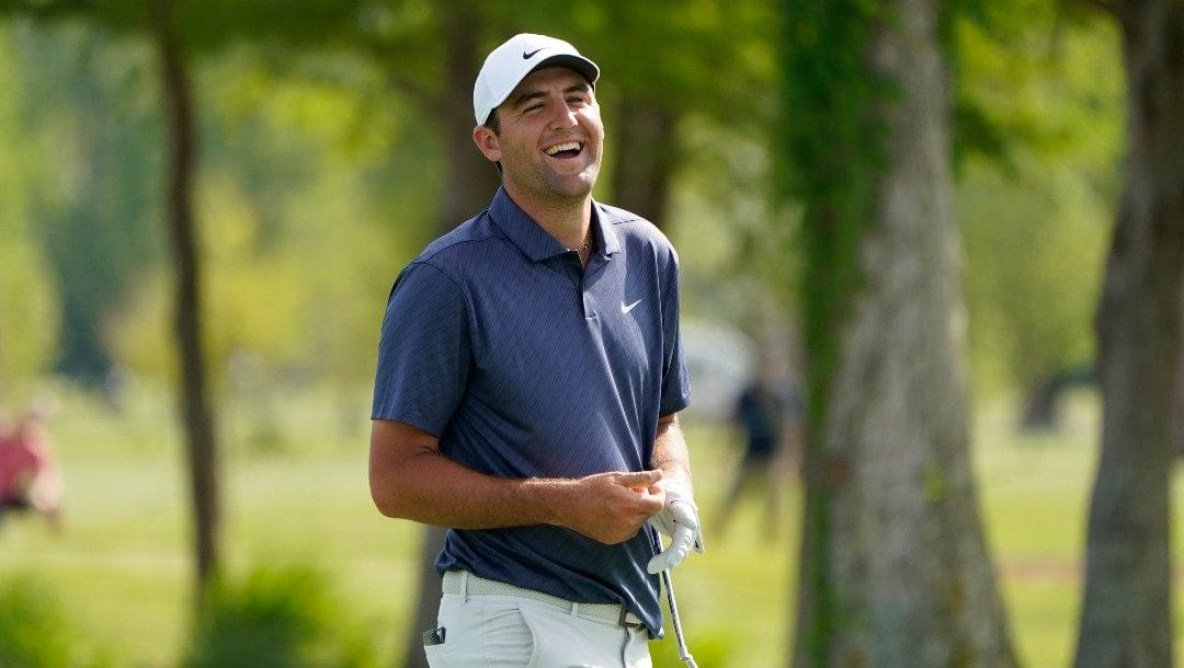 Scottie Scheffler reacts after hitting out of the sand and landing near the 13th pin during the first round of the PGA Zurich Classic golf tournament at TPC Louisiana in Avondale, La., Thursday, April 21, 2022.