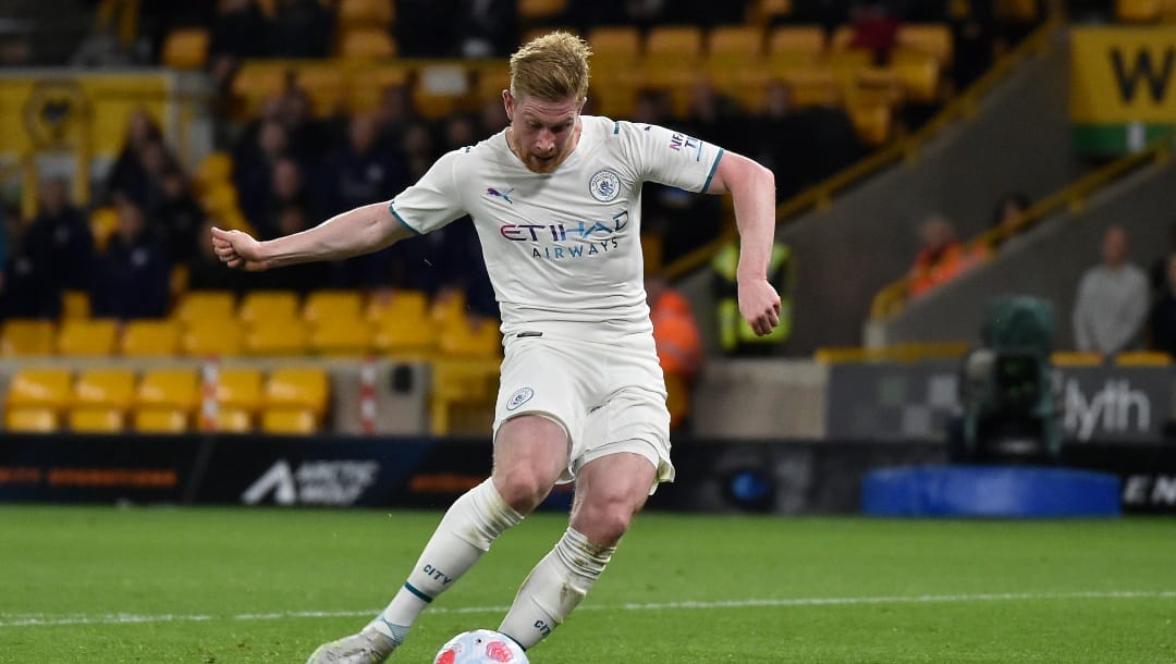 Manchester City's Kevin De Bruyne scores his fourth goal during the English Premier League soccer match between Wolverhampton Wanderers and Manchester City at Molineux stadium in Wolverhampton, England, Wednesday, May 11, 2022.