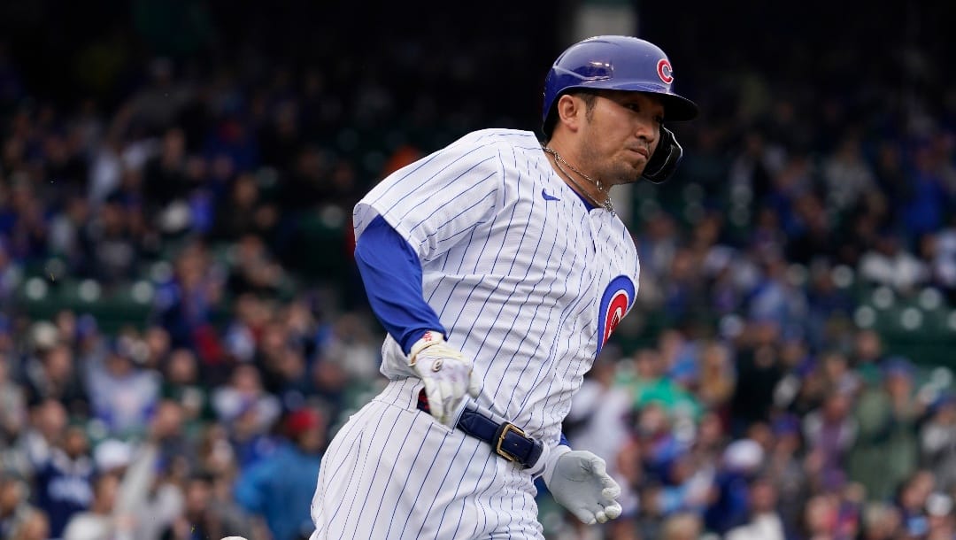 Chicago Cubs' Seiya Suzuki, of Japan, runs after hitting a one-run double during the third inning of a baseball game against the Arizona Diamondbacks in Chicago, Saturday, May 21, 2022. (