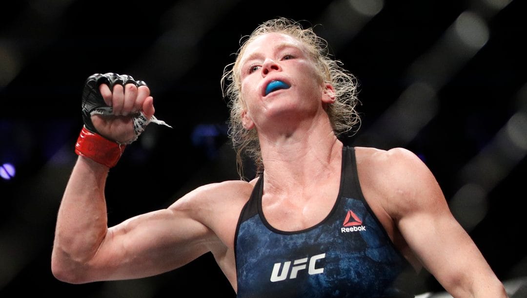 Holly Holm celebrates after defeating Raquel Pennington during a UFC 246 women's bantamweight mixed martial arts bout Saturday, Jan. 18, 2020, in Las Vegas.