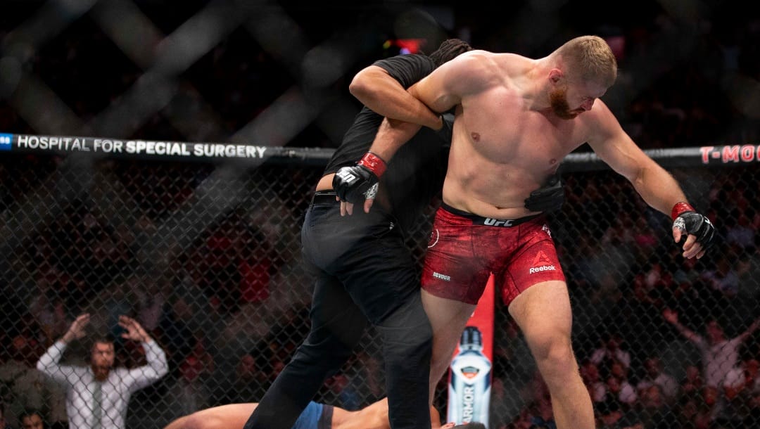 Jan Blachowicz, right, reacts after knocking out Luke Rockhold during the second round of their light heavyweight mixed martial arts bout at UFC 239, Saturday, July 6, 2019, in Las Vegas.