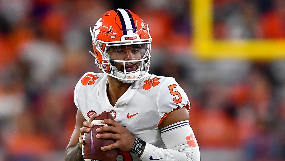 FILE - Clemson quarterback DJ Uiagalelei looks to pass during the first half of an NCAA college football game against Syracuse in Syracuse, N.Y., Friday, Oct. 15, 2021. (AP Photo/Adrian Kraus, File)