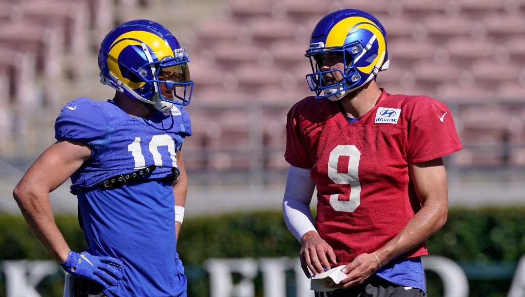 Los Angeles Rams wide receiver Cooper Kupp, left, talks with quarterback Matthew Stafford during practice for an NFL Super Bowl football game Thursday, Feb. 10, 2022, in Pasadena, Calif. The Rams are scheduled to play the Cincinnati Bengals in the Super Bowl on Sunday. (AP Photo/Mark J. Terrill)