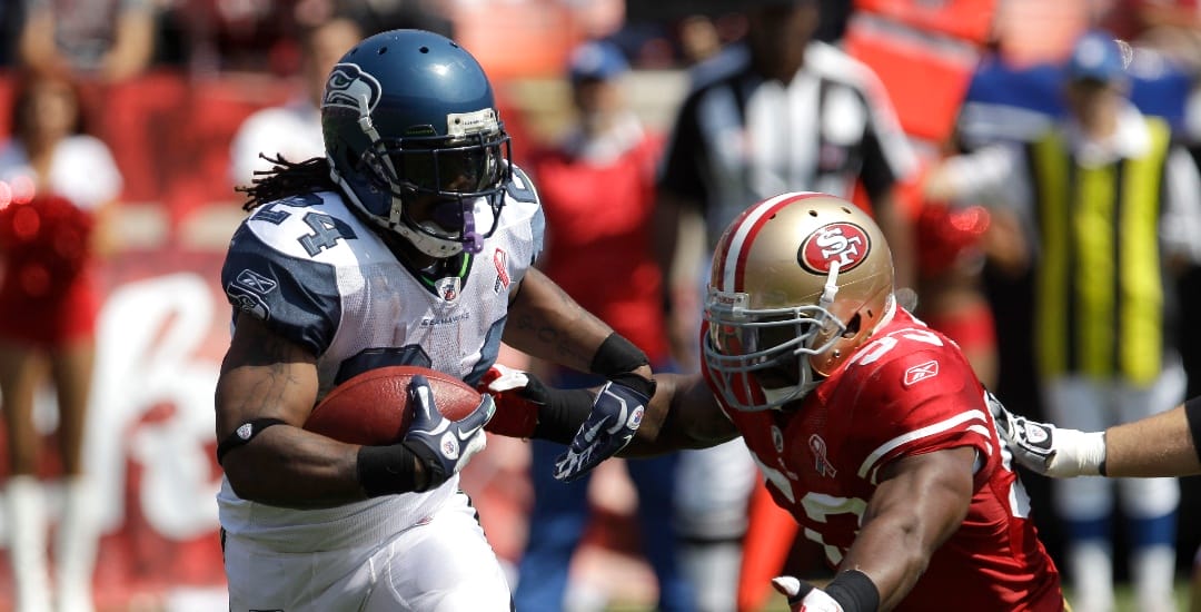 Seattle Seahawks running back Marshawn Lynch (24) runs against San Francisco 49ers linebacker NaVorro Bowman (53) in an NFL football game in San Francisco, Sunday, Sept. 11, 2011.