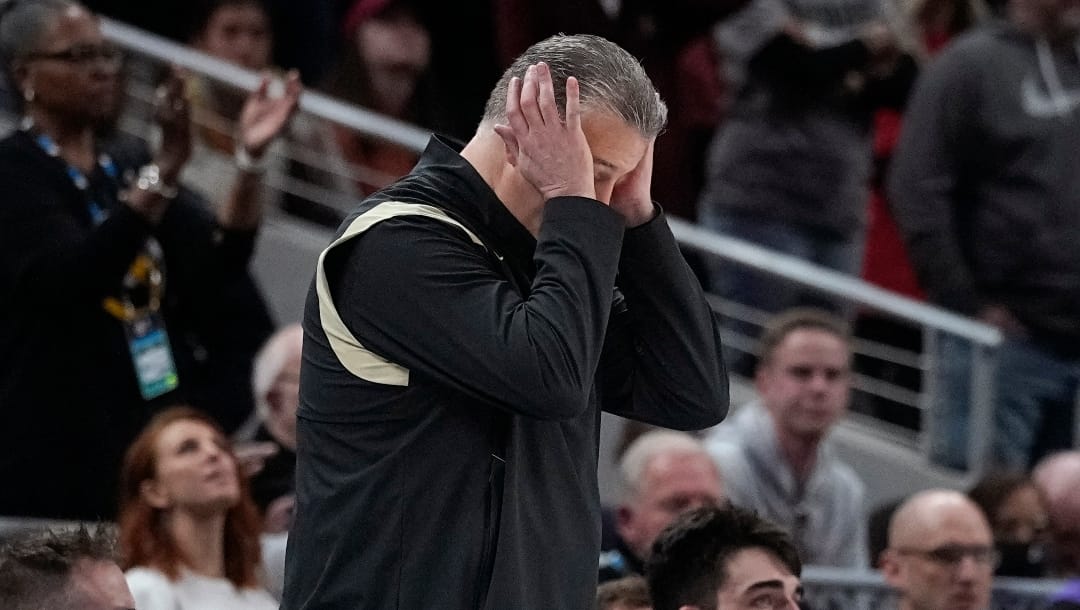 Purdue head coach Matt Painter reacts on the bench during the second half of an NCAA college basketball game against Iowa at the Big Ten Conference tournament, Sunday, March 13, 2022, in Indianapolis. (AP Photo/Darron Cummings)
