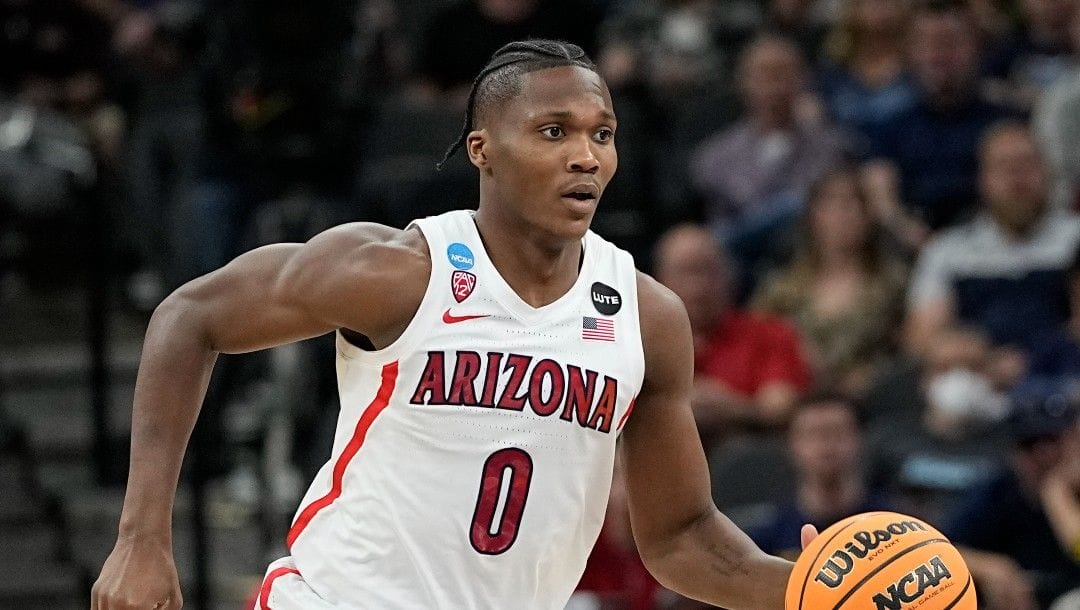 Arizona guard Bennedict Mathurin brings the ball down court against Houston during the first half of a college basketball game in the Sweet 16 round of the NCAA tournament on Thursday, March 24, 2022, in San Antonio.
