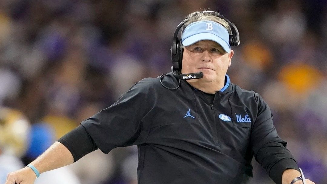UCLA head coach Chip Kelly looks on during the second half of an NCAA college football game against Washington, Oct. 16, 2021, in Seattle. Kelly agreed to a new four-year contract with UCLA on Friday, Jan. 14, 2022.