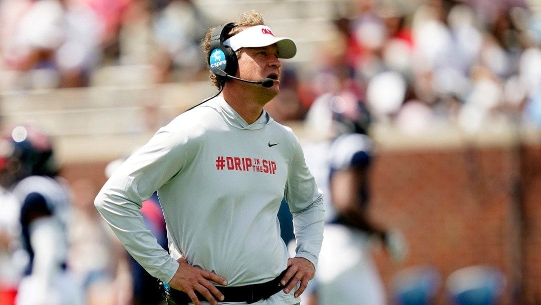 Mississippi head coach Lane Kiffin watches a replay on the field monitor during first half of The Grove Bowl, Mississippi's NCAA college spring football game, Saturday, April 23, 2022, in Oxford, Miss.