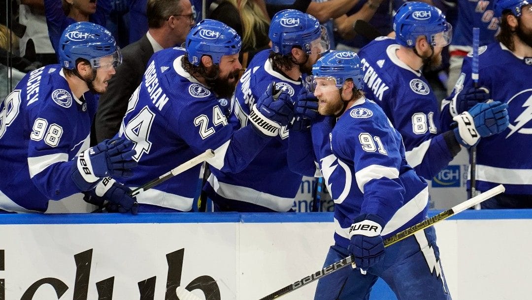 Tampa Bay Lightning center Steven Stamkos (91) celebrates with the bench after his goal against the New York Rangers during the third period in Game 6 of the NHL hockey Stanley Cup playoffs Eastern Conference finals Saturday, June 11, 2022, in Tampa, Fla.