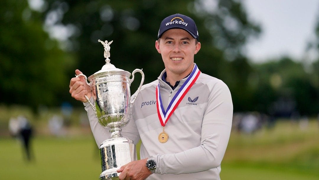 Matthew Fitzpatrick, of England, poses with the trophy after winning the U.S. Open golf tournament at The Country Club, Sunday, June 19, 2022, in Brookline, Mass.