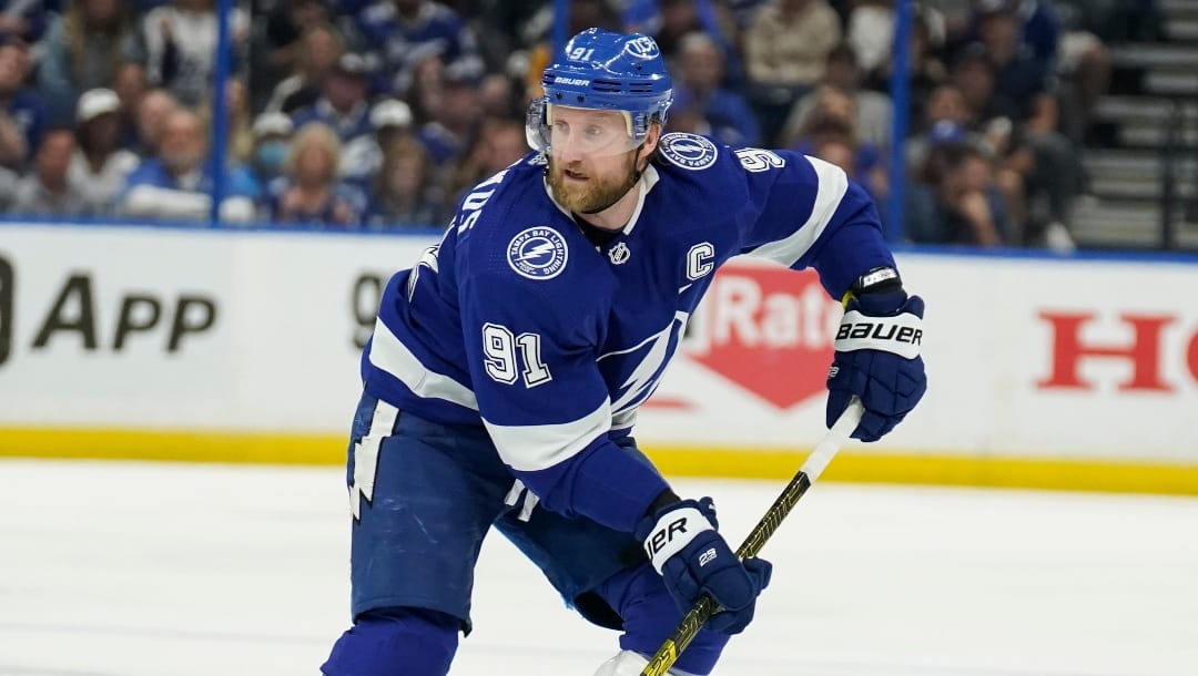 Tampa Bay Lightning center Steven Stamkos (91) moves the puck against the New York Rangers during the second period in Game 6 of the NHL hockey Stanley Cup playoffs Eastern Conference finals, Saturday, June 11, 2022, in Tampa, Fla.