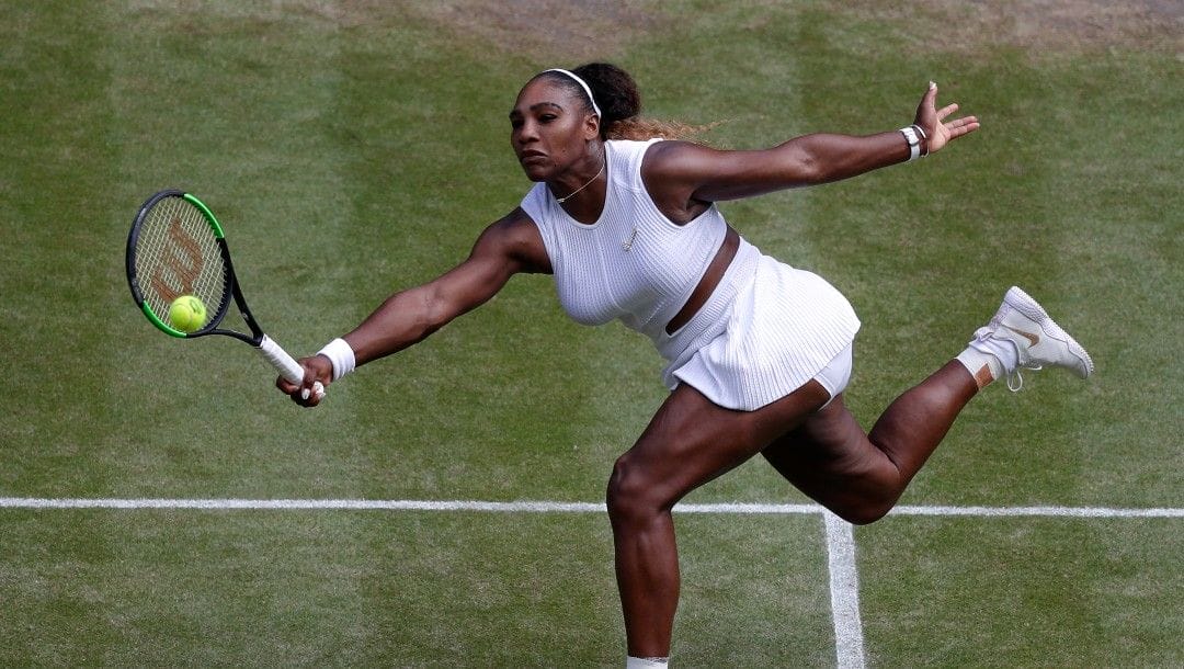 Serena Williams returns to Czech Republic's Barbora Strycova during a women's singles semifinal match on day ten of the Wimbledon Tennis Championships in London, Thursday, July 11, 2019.