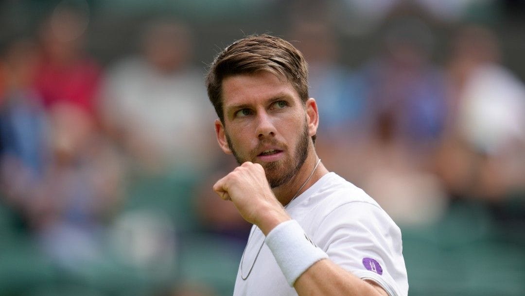 Britain's Cameron Norrie celebrates winning a point against Spain's Jaume Munar during their singles tennis match on day three of the Wimbledon tennis championships in London, Wednesday, June 29, 2022.