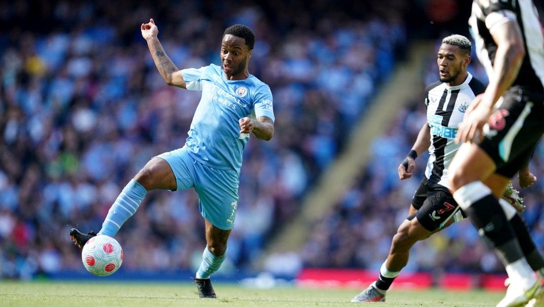 Manchester City's Raheem Sterling takes control of the ball during the English Premier League soccer match between Manchester City and Newcastle United at Etihad stadium in Manchester, England, Sunday, May 8, 2022.
