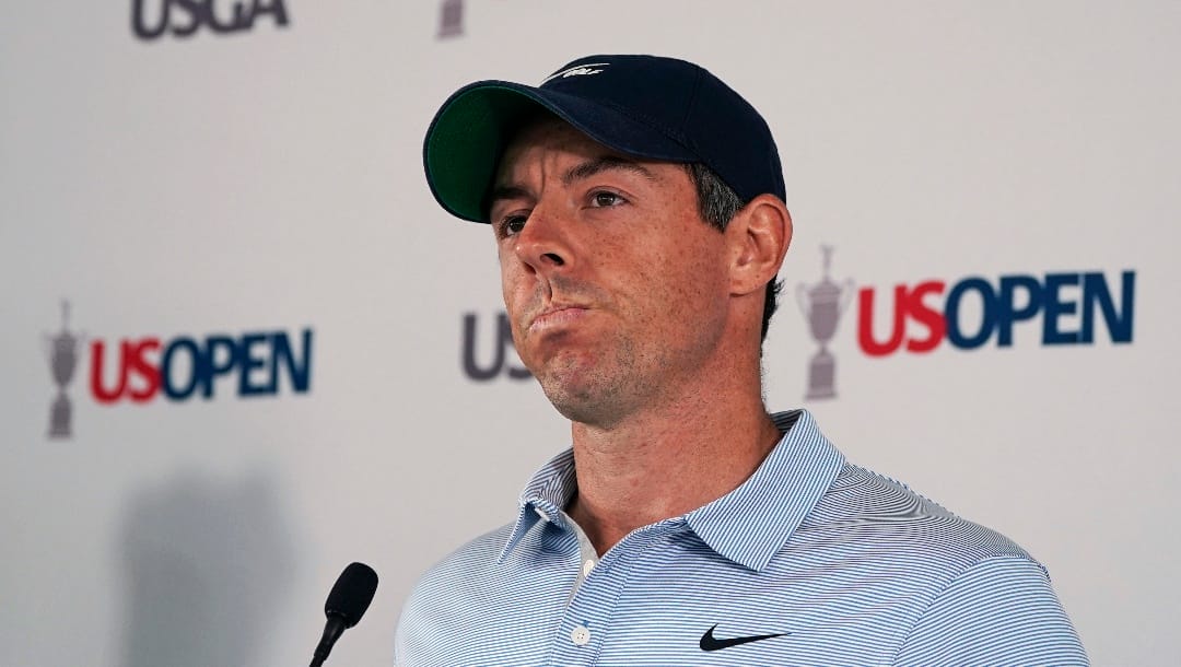 Rory McIlroy, of Northern Ireland, pauses while answering a question regarding the Saudi-funded LIV Golf Invitational series during a media availability ahead of the U.S. Open golf tournament, Tuesday, June 14, 2022, at The Country Club in Brookline, Mass. (AP Photo/Charles Krupa)